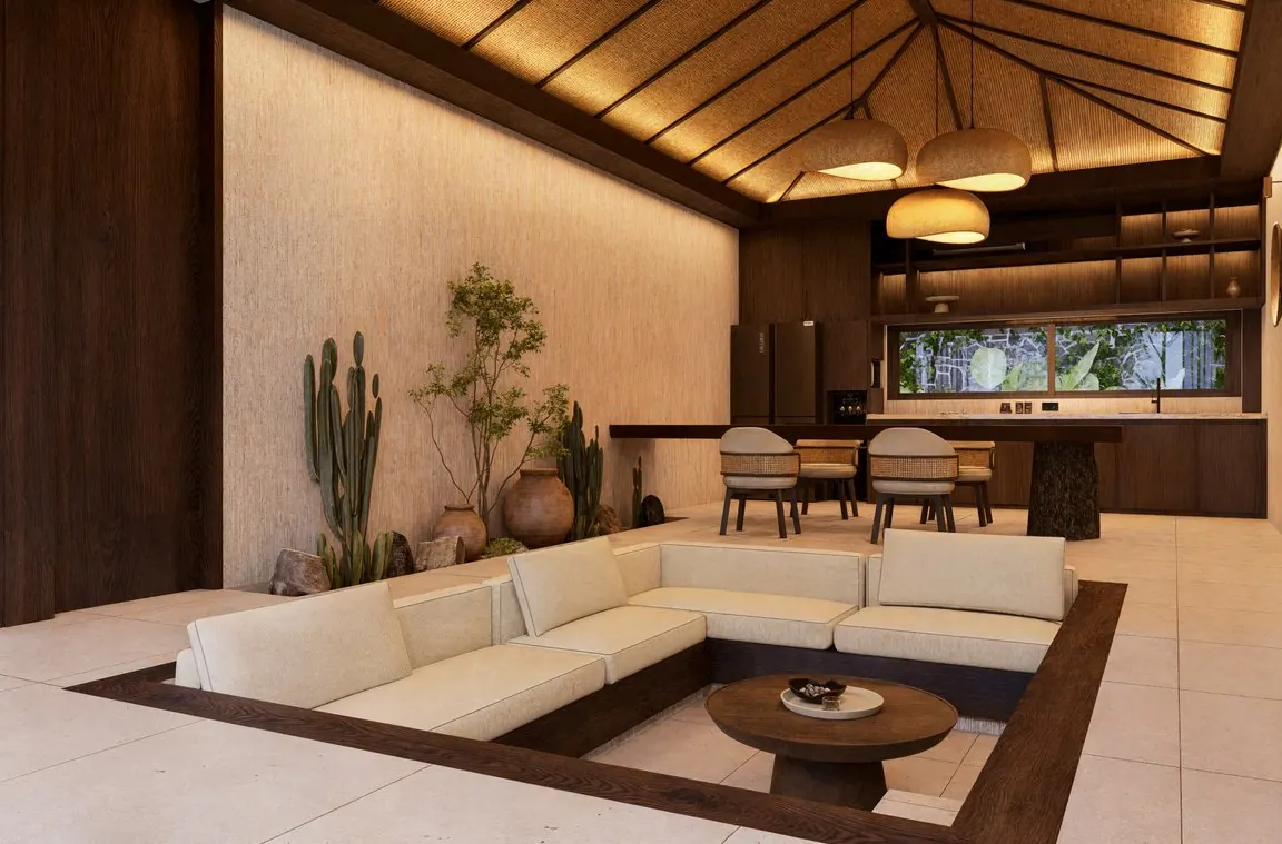 Salón con sofá hundido, lámparas de fibra y cocina abierta